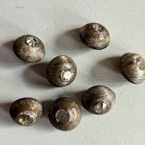 7 small vintage metal buttons with clear rhinestone.